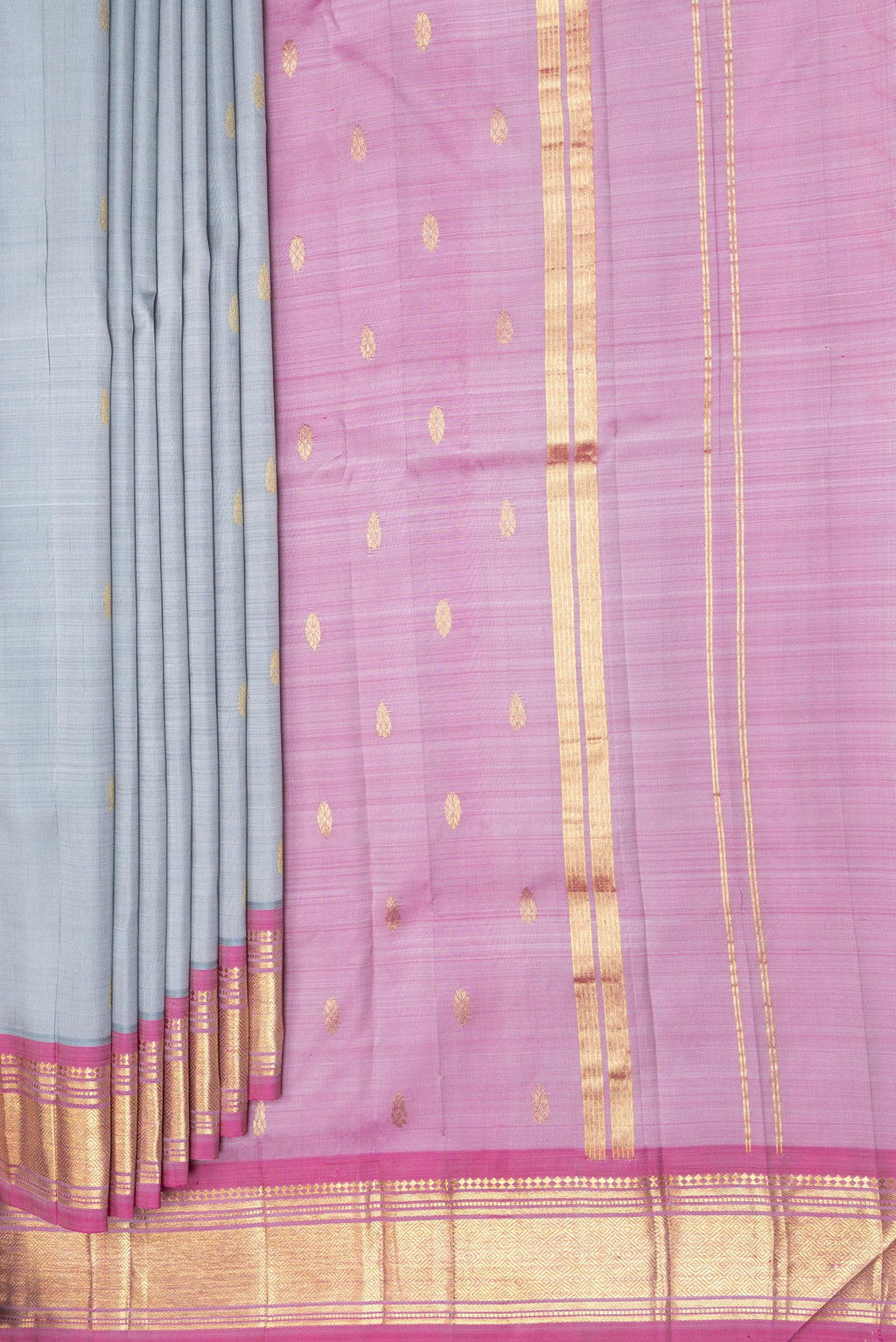 Pleats and pallu of Grey Kanjivaram Silk Saree with Zari Butta on the body and One Side Border. 