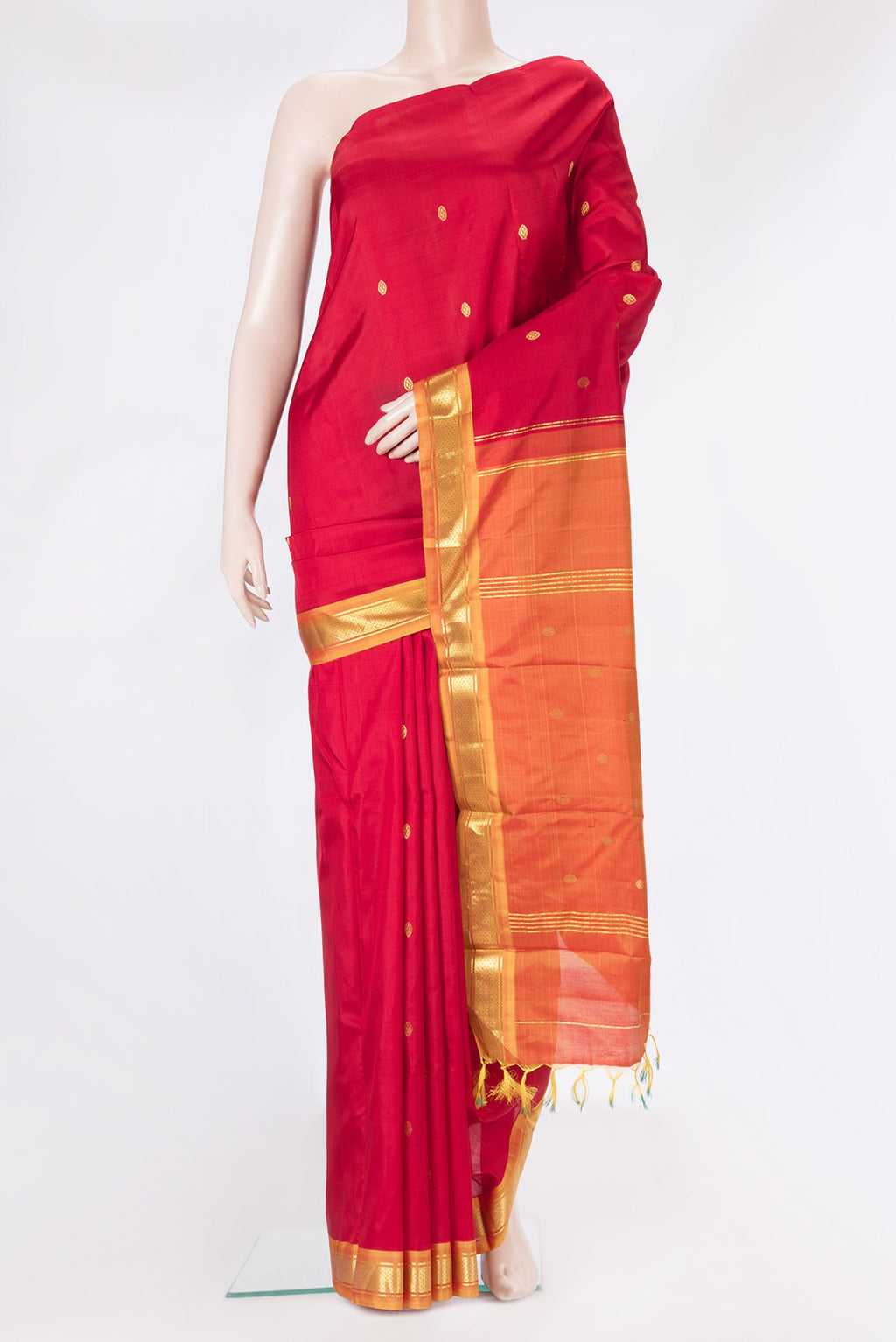 Red Kanchipuram Silk Saree with Zari Butta on the body and Zari Border.  displayed on a mannequin