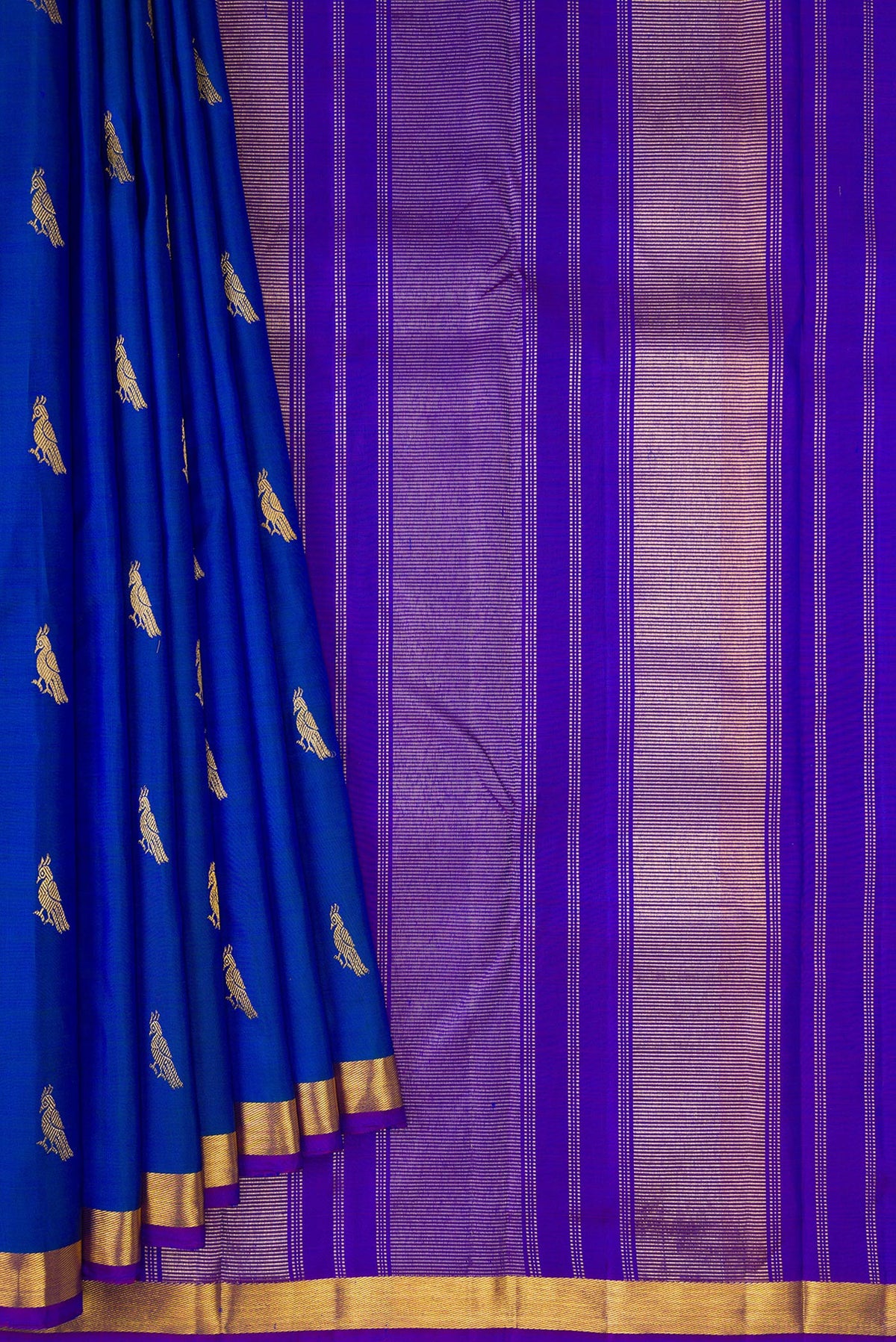 Pleats and pallu of Royal Blue Dual Tone Kanchipuram Silk Saree with Zari Butta on the body and Zari Border. 