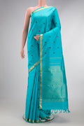 Sky Blue Dual Tone Kanchipuram Silk Saree with Thread Butta on the body and Zari Border.  displayed on a mannequin