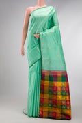 Sea Green Dual Tone Kanchipuram Silk Saree with Zari Butta on the body and Thin Zari Line.  displayed on a mannequin