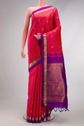 Coral Dual Tone Kanchipuram Silk Saree with Zari Butta on the body and Zari Border.  displayed on a mannequin