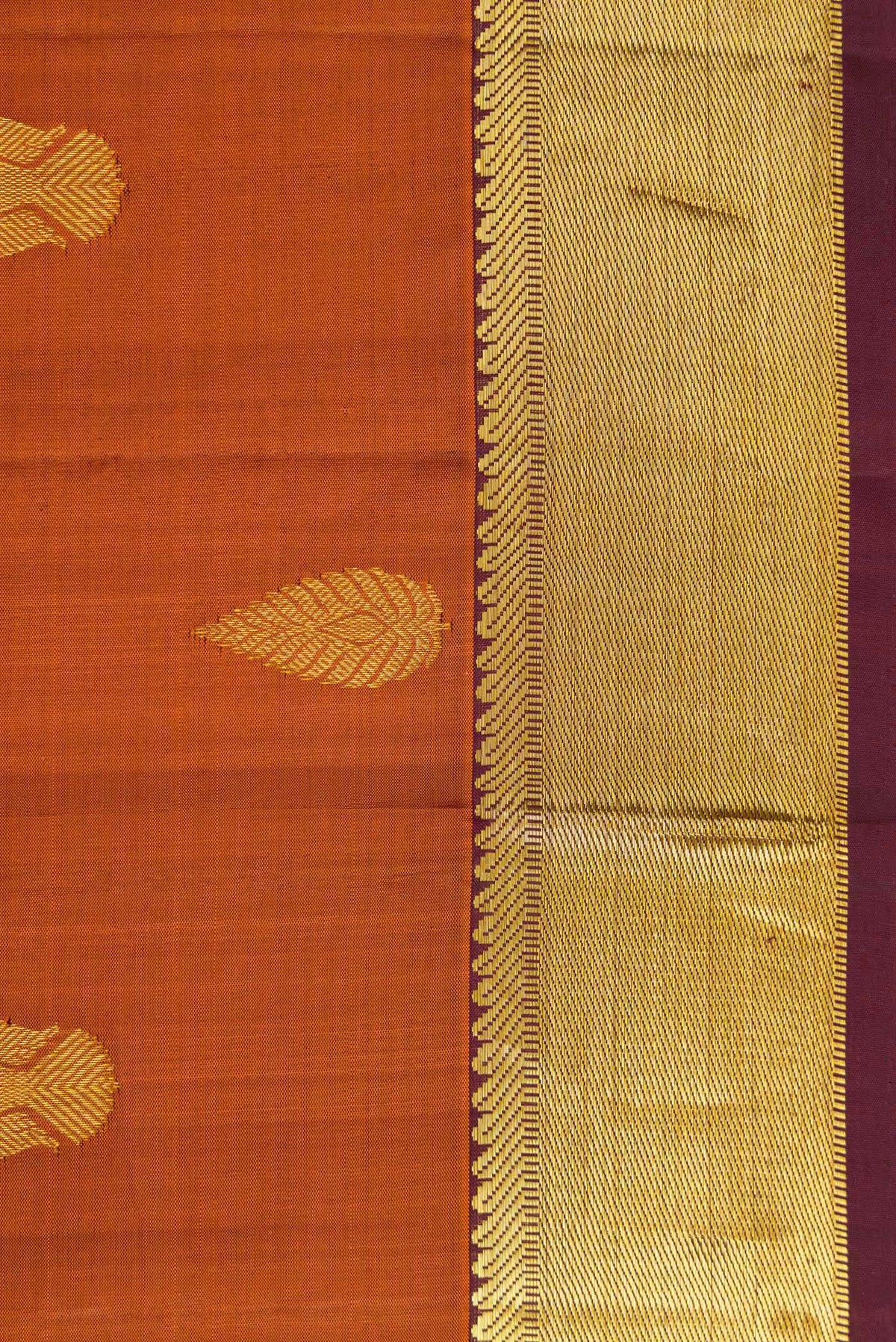Border image of Brick Orange Dual Tone Kanjivaram Silk Saree with Zari Butta on the body and Zari Border. 
