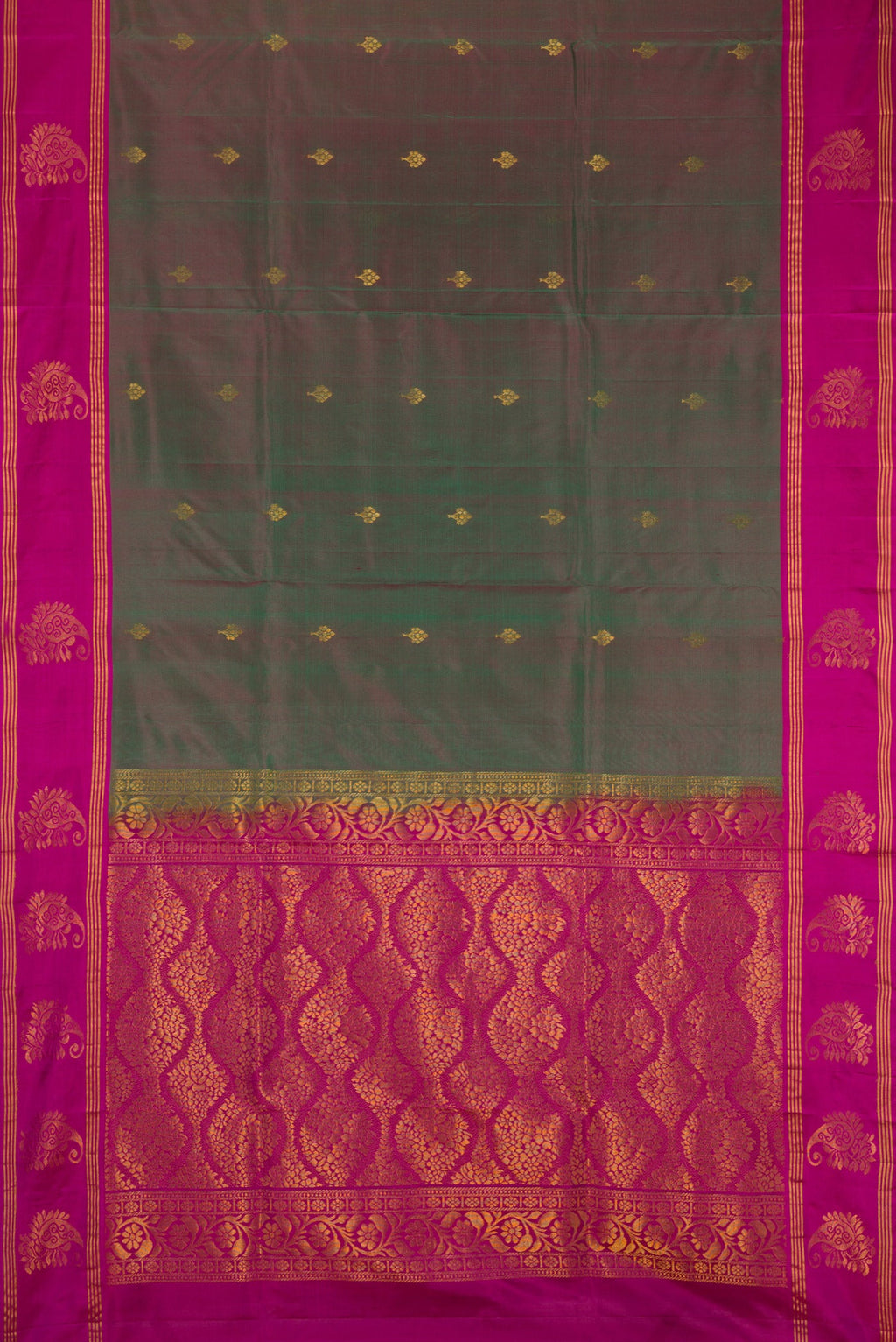 Multi Color Soft Silk Saree with Zari Butta on the body and Fancy Border.  displayed on a mannequin