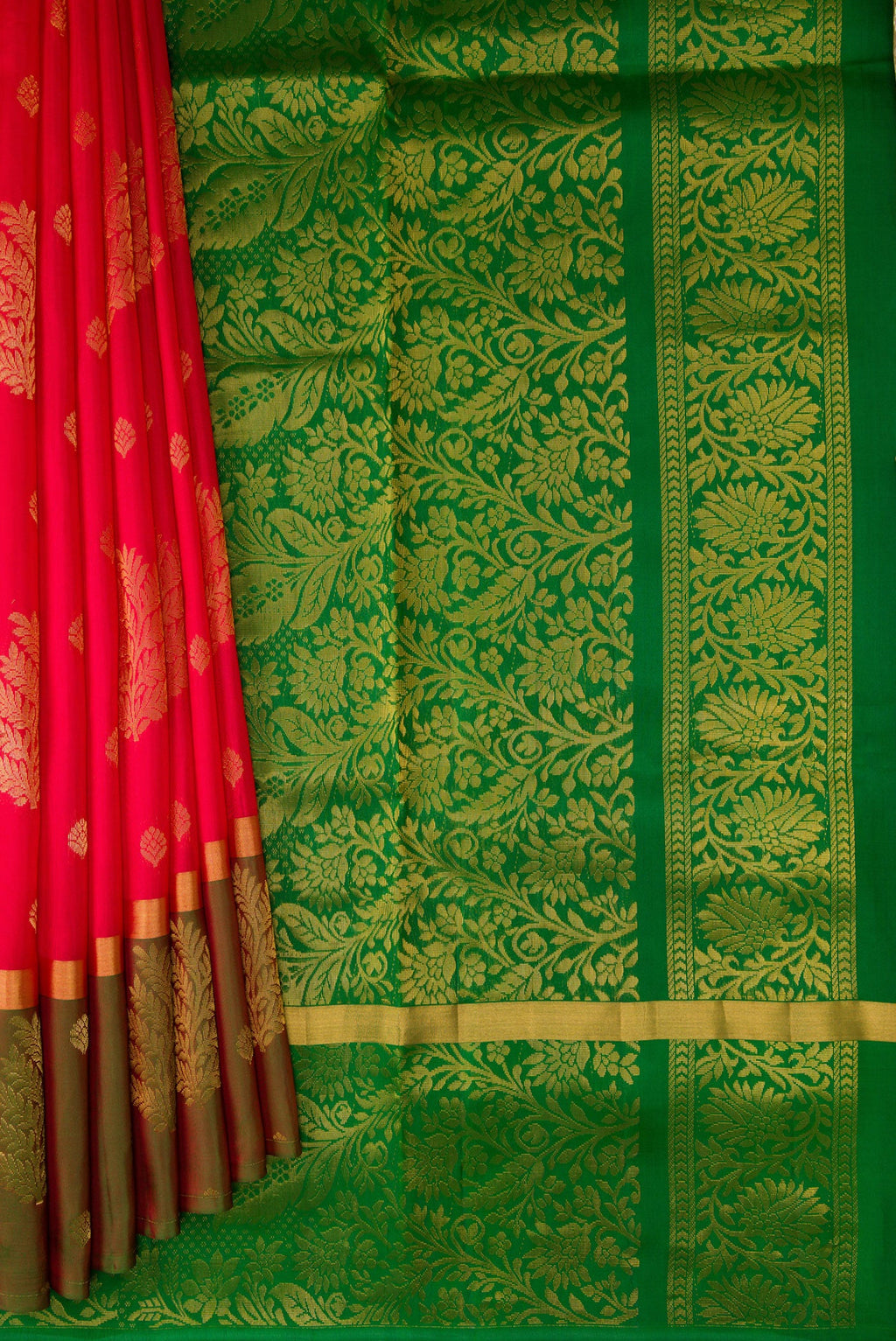 Pleats and pallu of Pink Soft Silk Saree with Zari Butta on the body and Fancy Border. 