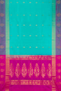 Sea Green Soft Silk Saree with Zari Butta on the body and Fancy Border.  displayed on a mannequin