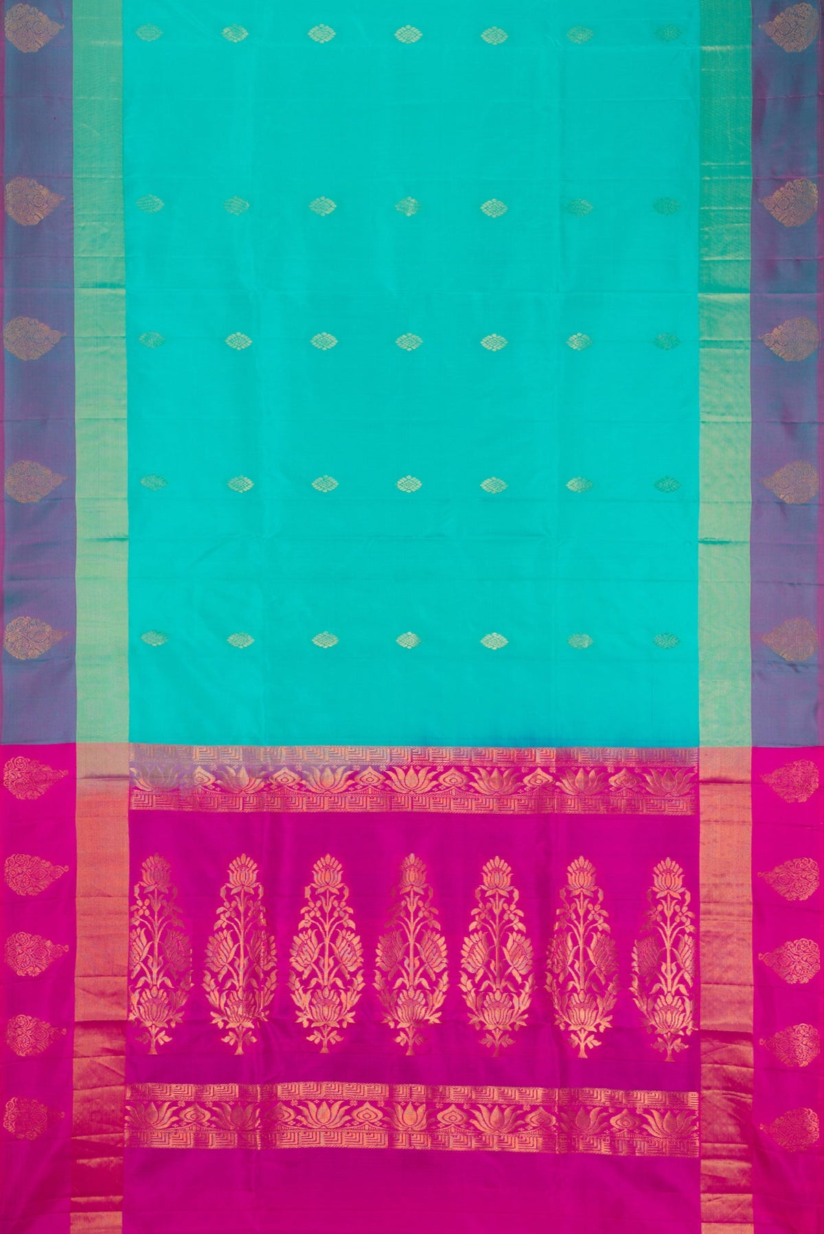 Sea Green Soft Silk Saree with Zari Butta on the body and Fancy Border.  displayed on a mannequin
