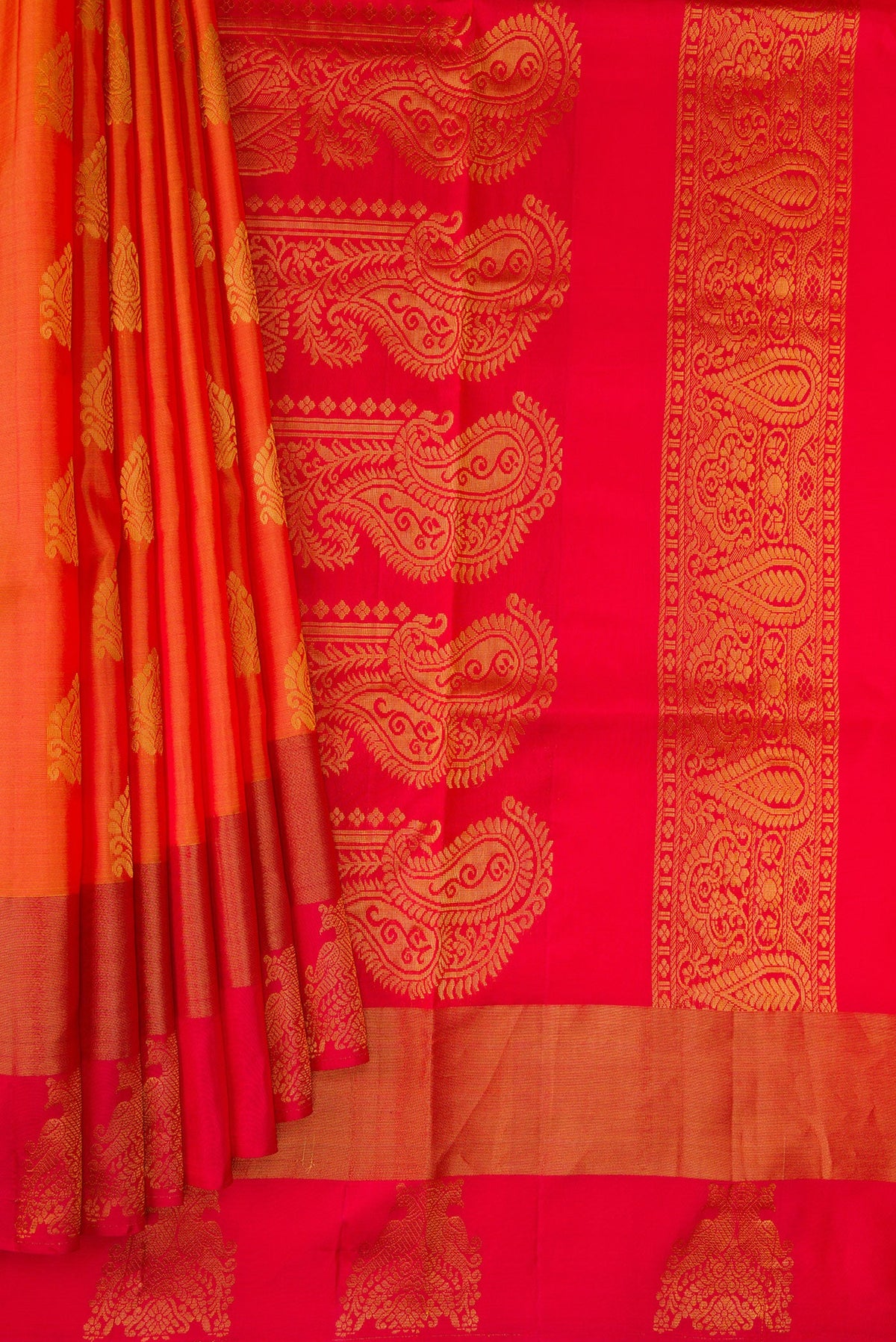 Pleats and pallu of Orange Dual Tone Soft Silk Saree with Zari Butta on the body and Fancy Border. 