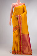 Yellow Dual Tone Kanchipuram Silk Saree with Zari Butta on the body and Zari Border.  displayed on a mannequin
