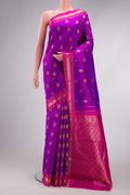 Purple Kanchipuram Silk Saree with Zari Butta on the body and Zari Border.  displayed on a mannequin