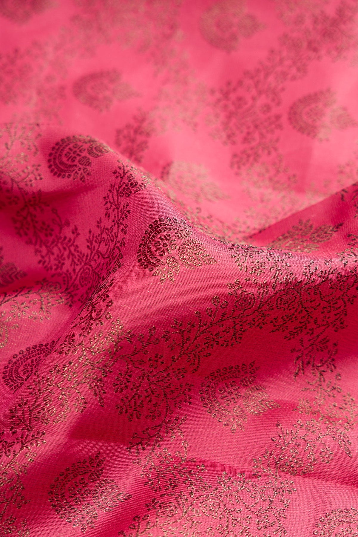 Close up of Pink Dual Tone Kanjivaram Silk Saree with Jacquard design on the body and Fancy Border.  displaying folds