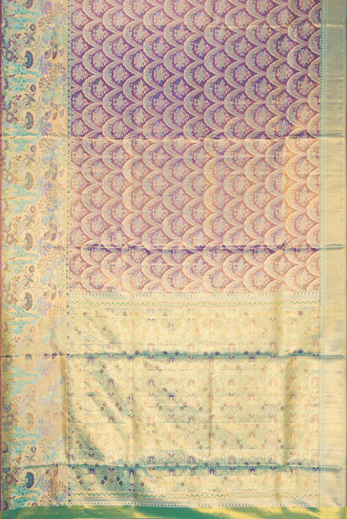 Flat view of Royal Blue Dual Tone Kanjivaram Tissue Silk Saree with Zari Brocade on the body and Zari Border. 