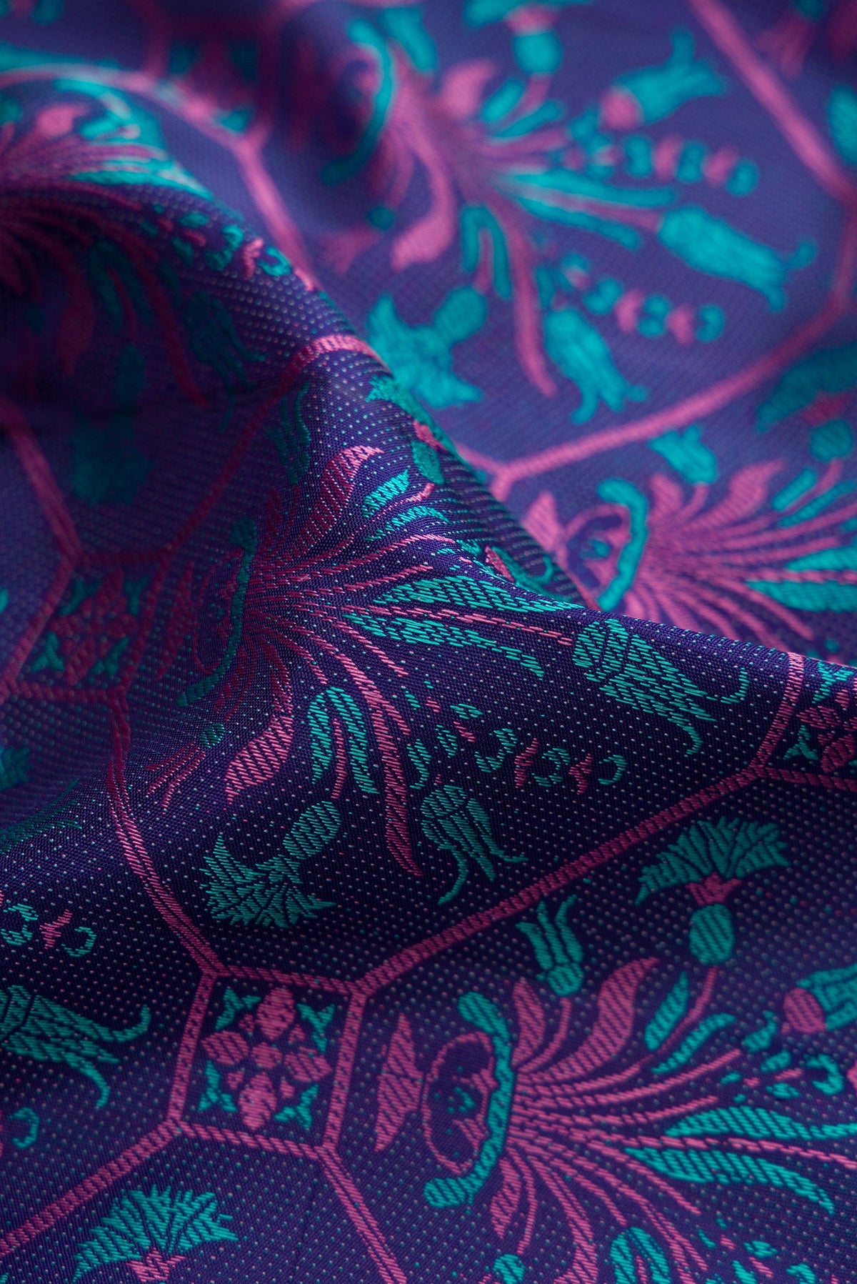 Close up of Navy Blue Kanchipuram Silk Saree with Jacquard design on the body and Fancy Border.  displaying folds