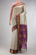 Grey Silk Cotton Saree with Plain Body and Zari Border.  displayed on a mannequin