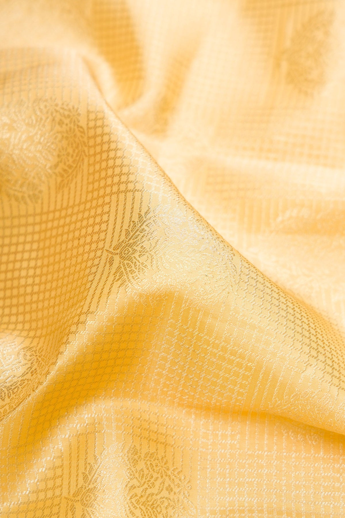 Close up of Sandal Kanchipuram Silk Saree with Zari Brocade on the body and Zari Border.  displaying folds
