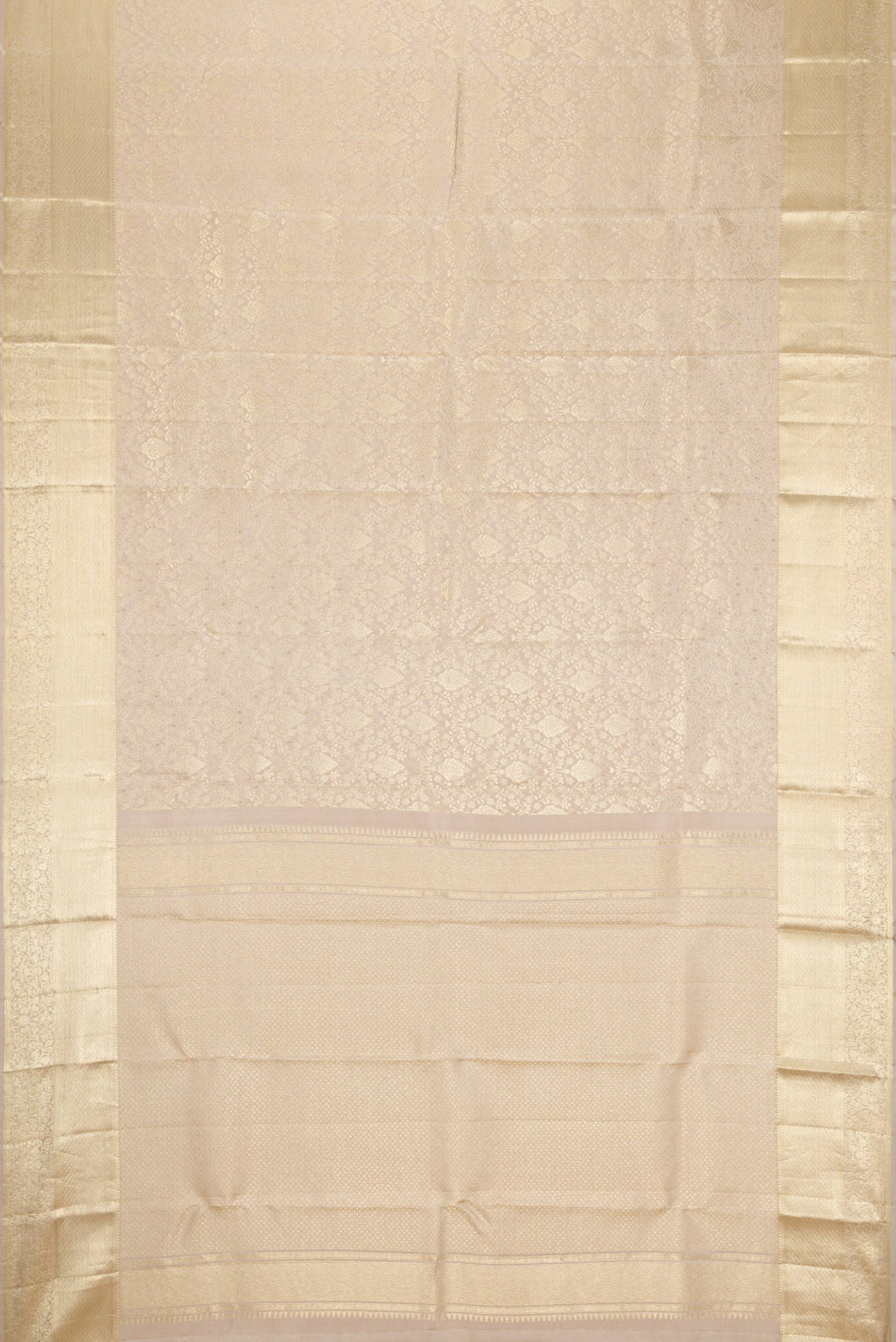 Flat view of Off White Kanchipuram Silk Saree with Zari Brocade on the body and Zari Border. 