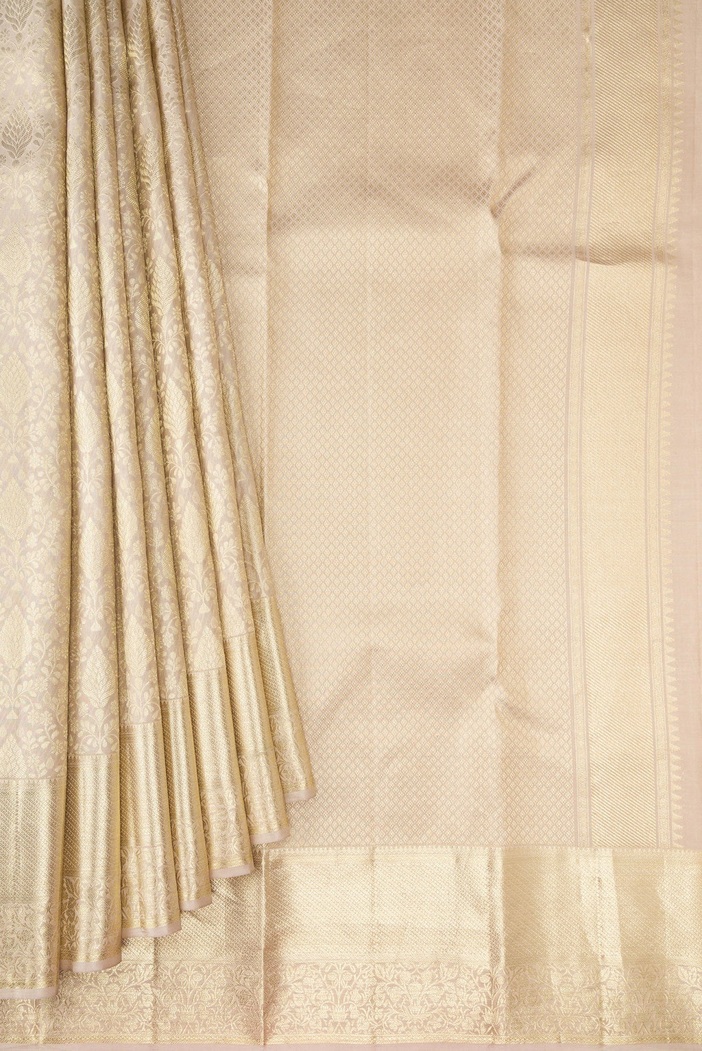 Pleats and pallu of Off White Kanchipuram Silk Saree with Zari Brocade on the body and Zari Border. 