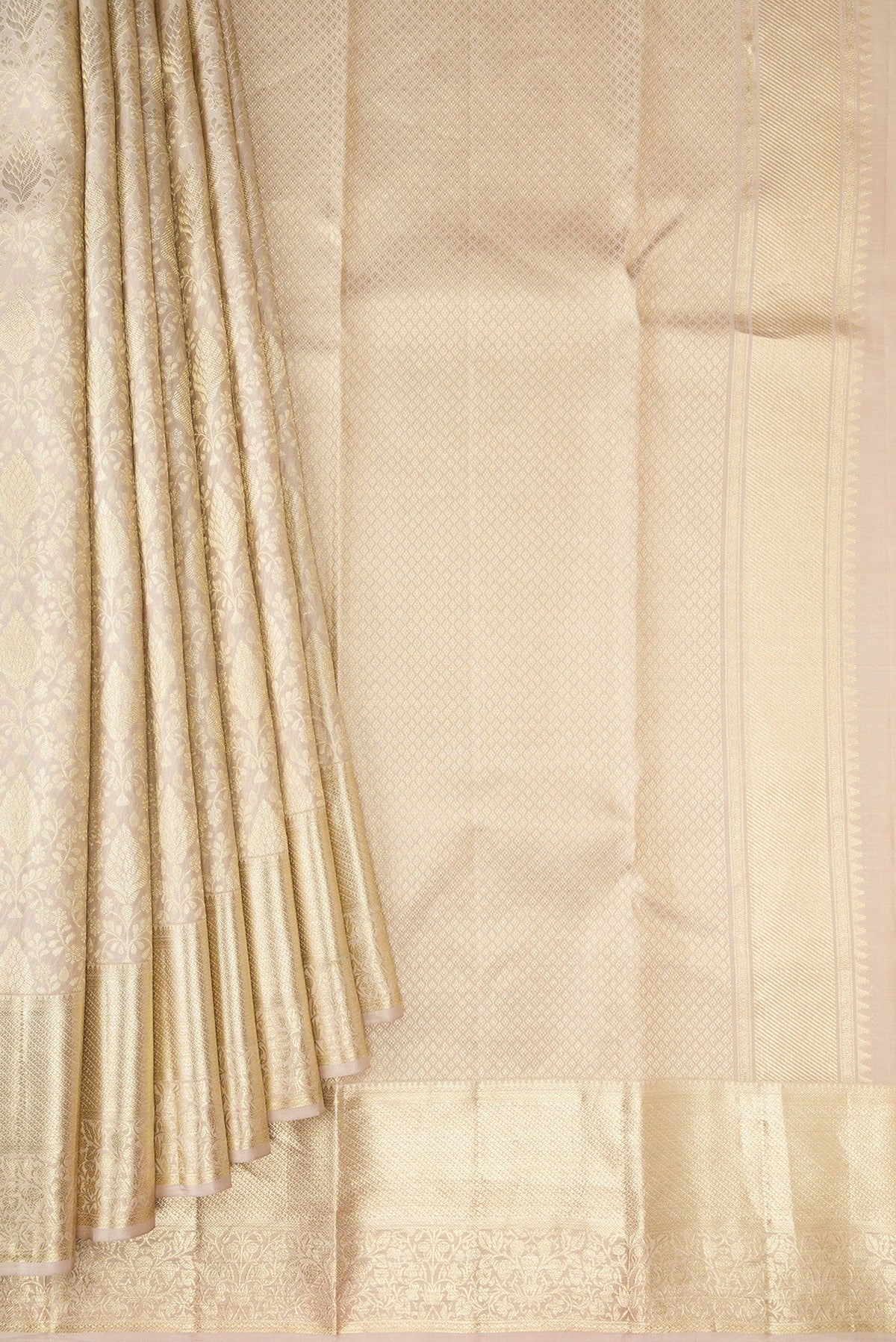 Pleats and pallu of Off White Kanchipuram Silk Saree with Zari Brocade on the body and Zari Border. 