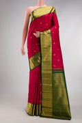 Red Kanchipuram Silk Saree with Zari Butta on the body and Zari Border.  displayed on a mannequin