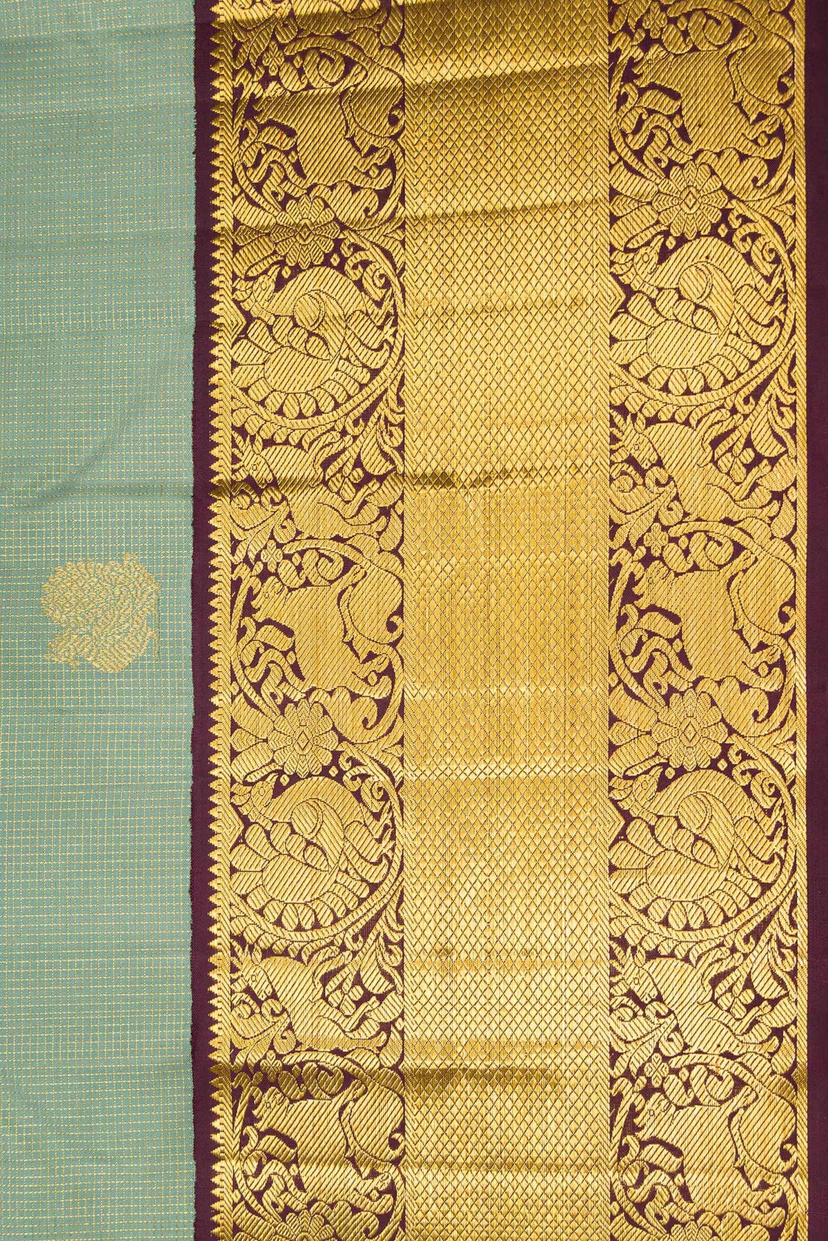 Border image of Green Dual Tone Kanchipuram Silk Saree with Checked design on the body and Fancy Border. 