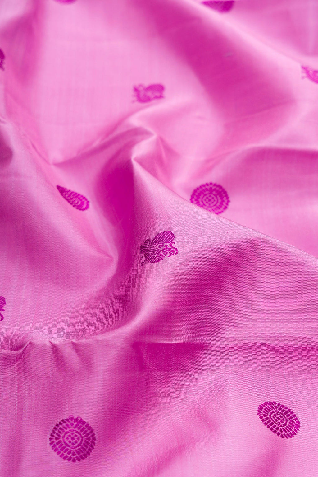 Close up of Pure Silk Pure Zari Lavender Kanchipuram Saree with Thread Butta on the body and Zari Border.  displaying folds
