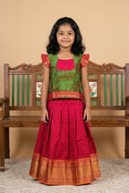 Green Readymade Cotton Pavadai Set with Zari Butta on the body and Zari Border displayed on a mannequin