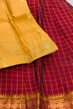 Detailed shot of Mustard Readymade Cotton Pavadai Set with Zari Butta on the body and Zari Border