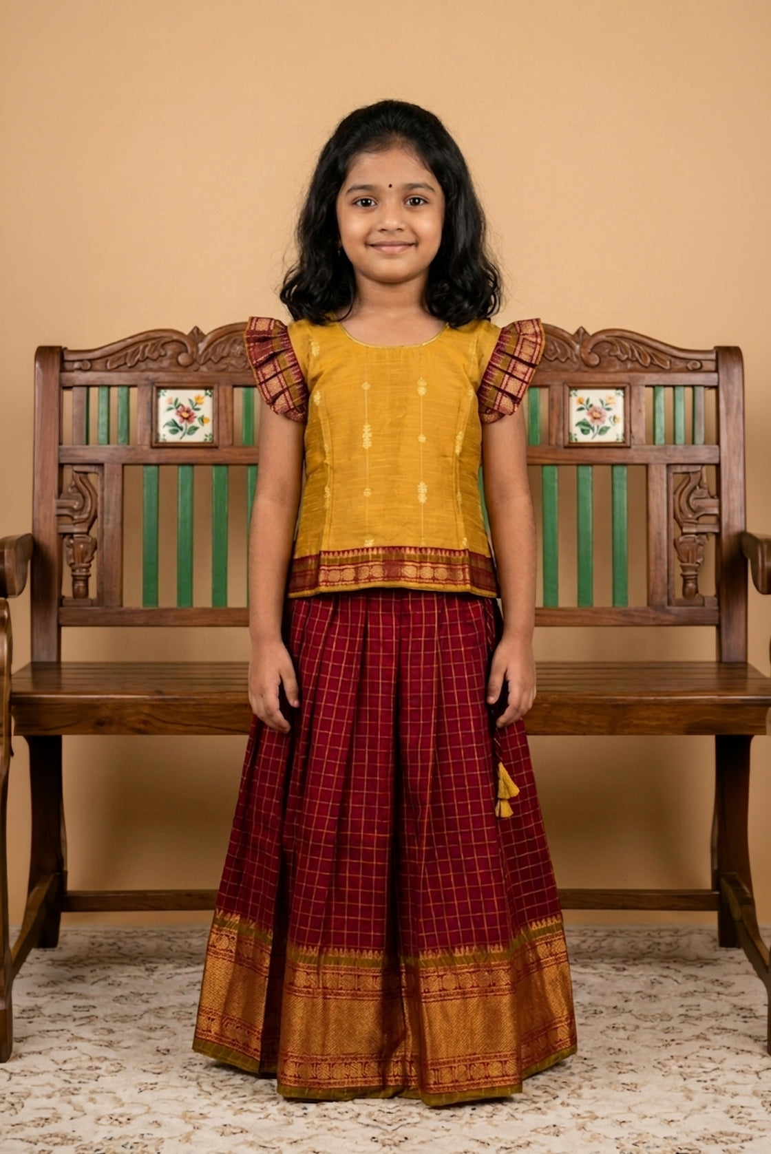 Mustard Readymade Cotton Pavadai Set with Zari Butta on the body and Zari Border displayed on a mannequin
