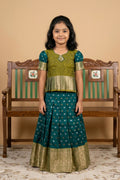 Mehandi Green Readymade Cotton Pavadai Set with Zari Butta on the body and Zari Border displayed on a mannequin