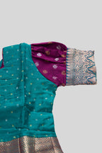 Close up sleeve details of Green Readymade Cotton Pavadai Set with Zari Butta on the body and Zari Border