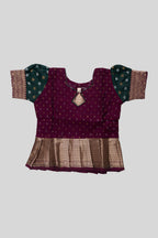 Close up blouse image of Magenta Readymade Cotton Pavadai Set with Zari Butta on the body and Zari Border