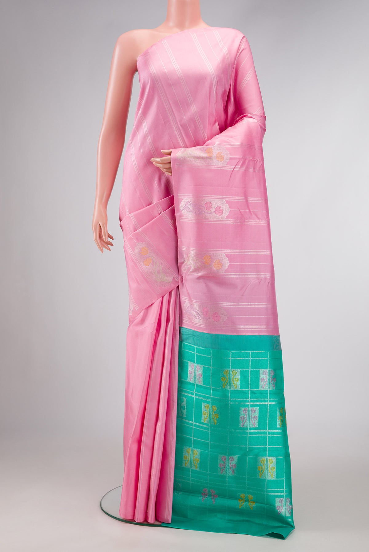 Pure Silk Pure Zari Pink Dual Tone Kanjivaram Saree with Stripes on the body and Fancy Border.  displayed on a mannequin