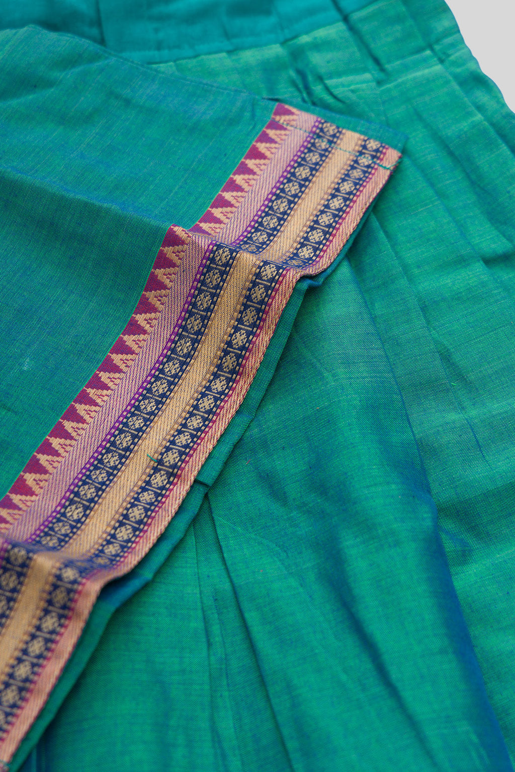 Detailed shot of Peacock Blue Readymade Cotton Pavadai Set with  on the body and Zari Border