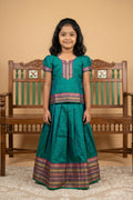 Peacock Blue Readymade Cotton Pavadai Set with  on the body and Zari Border displayed on a mannequin