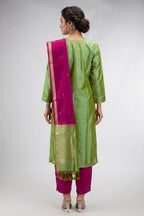 Green Pure Silk Womens Kurta set featuring Zari Butta Kurta paired with Magenta Plain Body bottom and a Zari Butta dupatta in Magenta back image displayed on an AI model