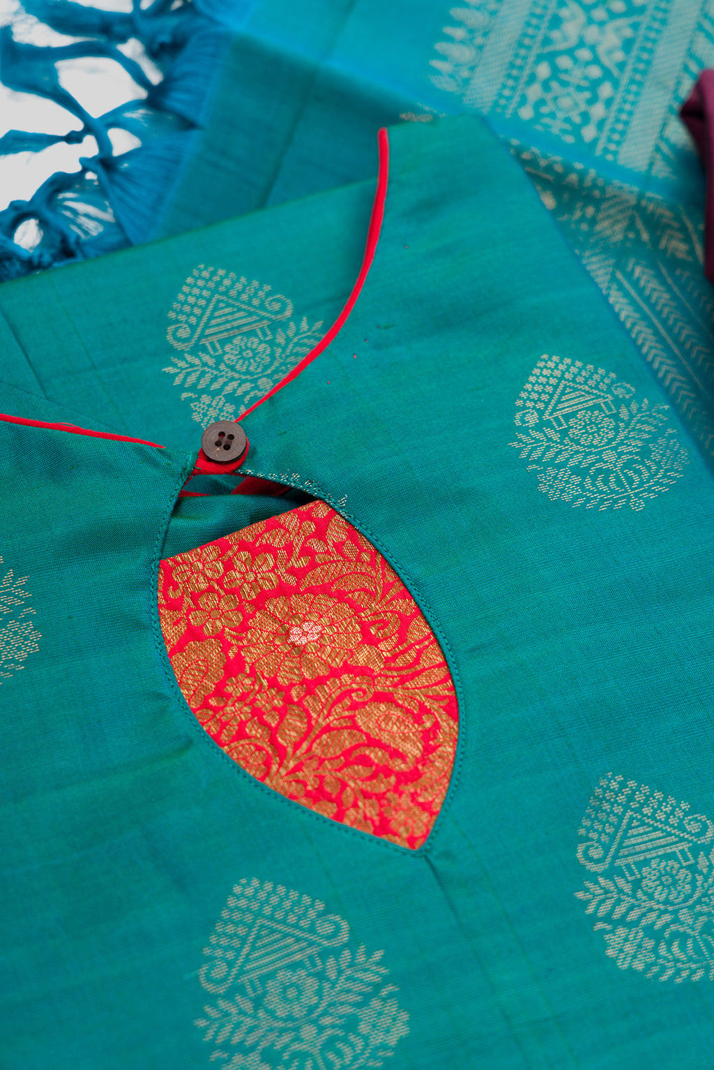 Detailed shot of Green Pure Silk Womens Kurta set featuring Zari Butta Kurta paired with Burgundy Plain Body bottom and a Zari Butta dupatta in Burgundy