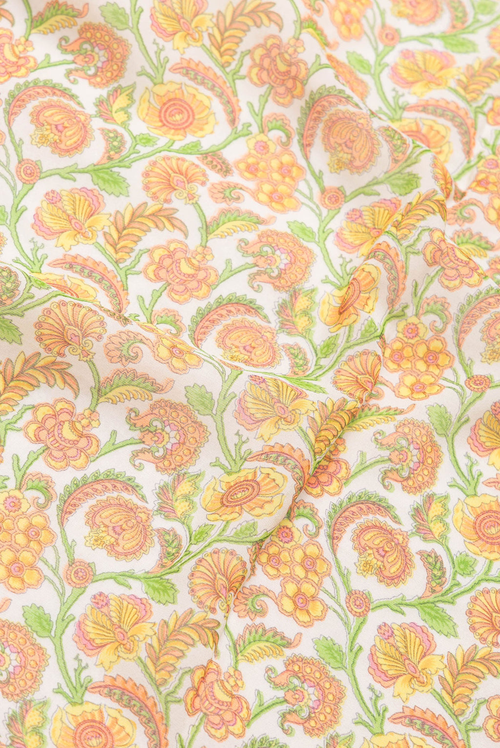 Close up of Beige Dual Tone Mysore Georgette Saree with Printed design on the body and Zari And Thread Border.  displaying folds