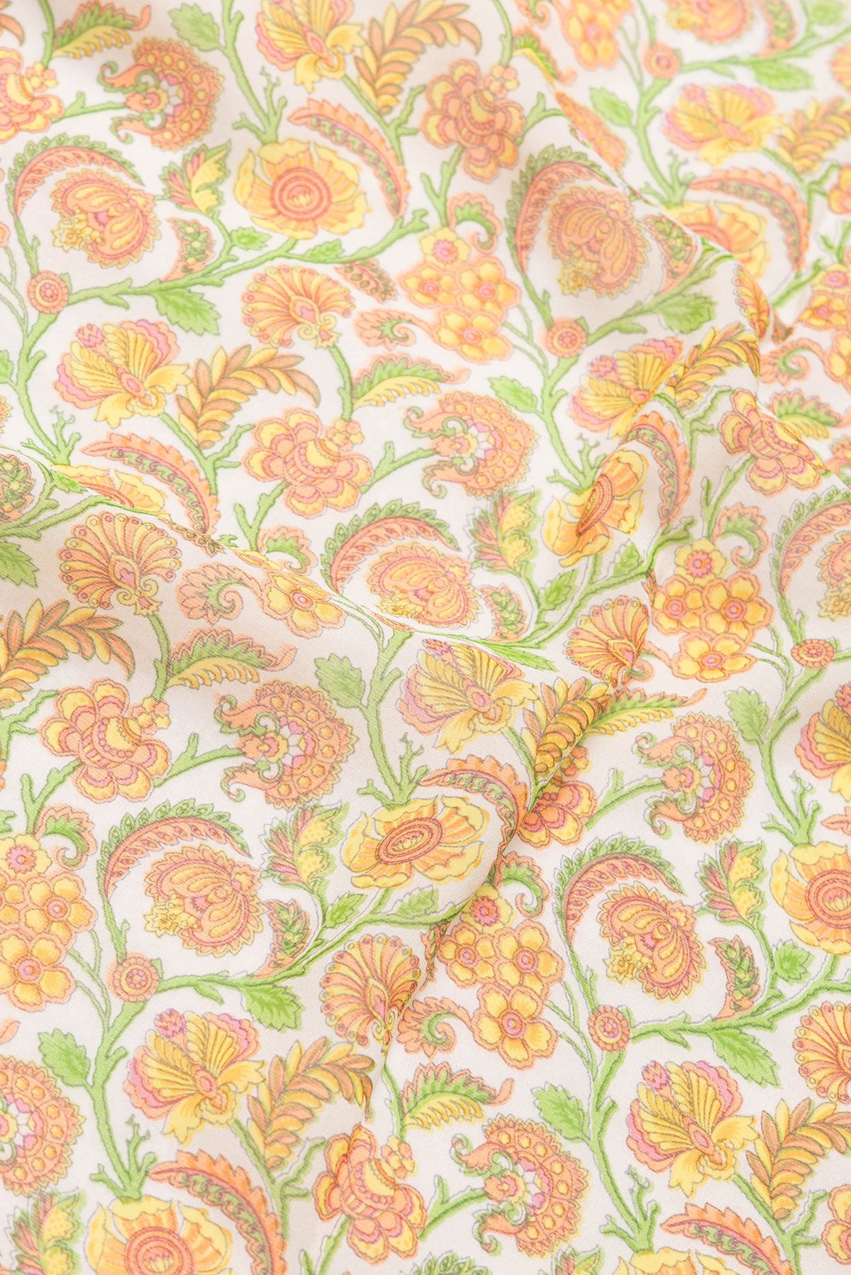 Close up of Beige Dual Tone Mysore Georgette Saree with Printed design on the body and Zari And Thread Border.  displaying folds