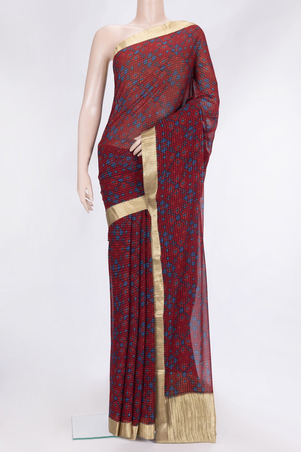 Maroon Dual Tone Mysore Georgette Saree with Printed design on the body and Zari Border.  displayed on a mannequin