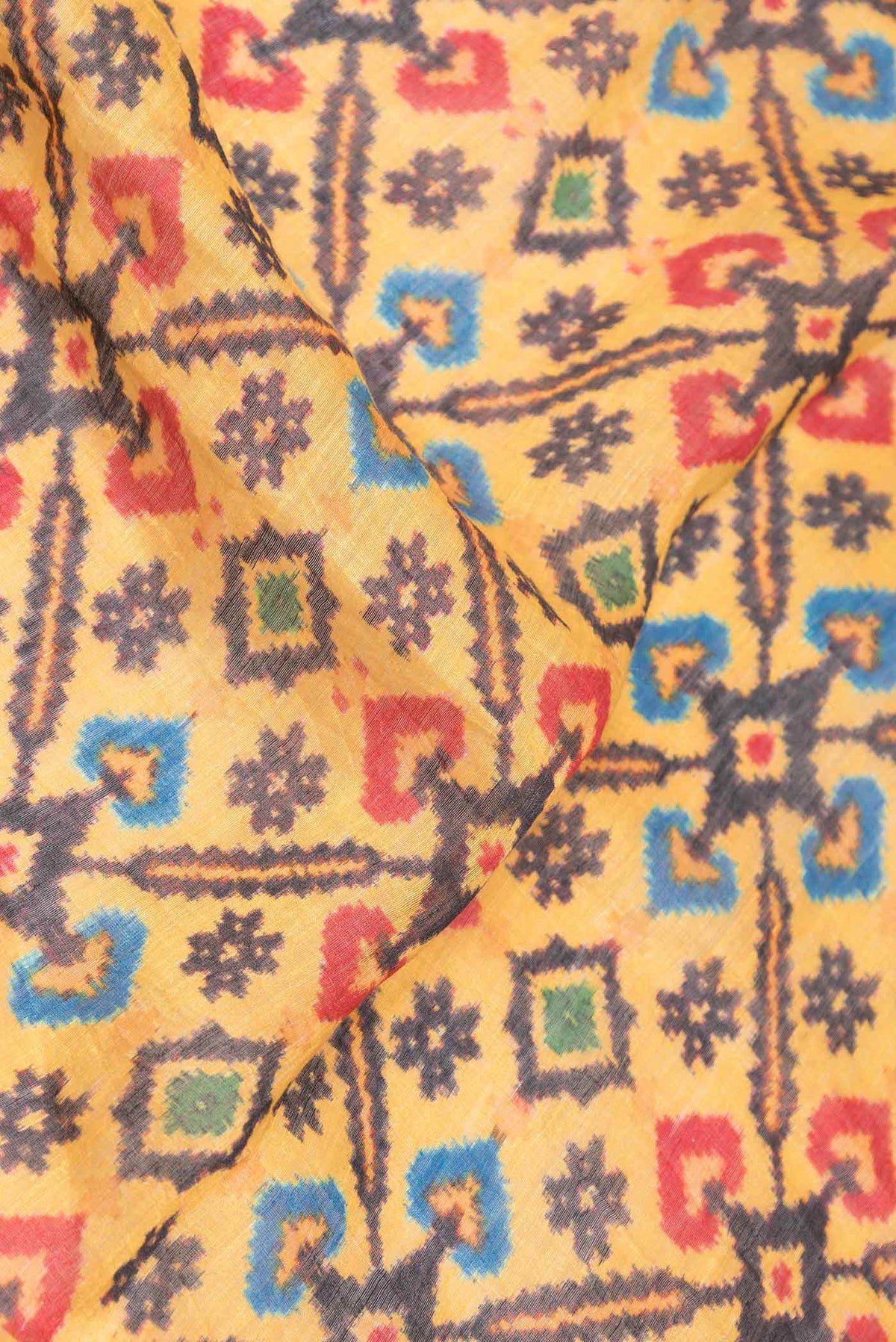 Close up of Yellow Dual Tone Linen Saree with Printed design on the body and Zari Border displaying folds