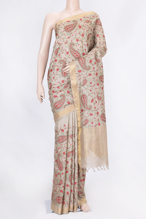 Beige Dual Tone Tussar Saree with Embroidery on the body and Zari Border displayed on a mannequin