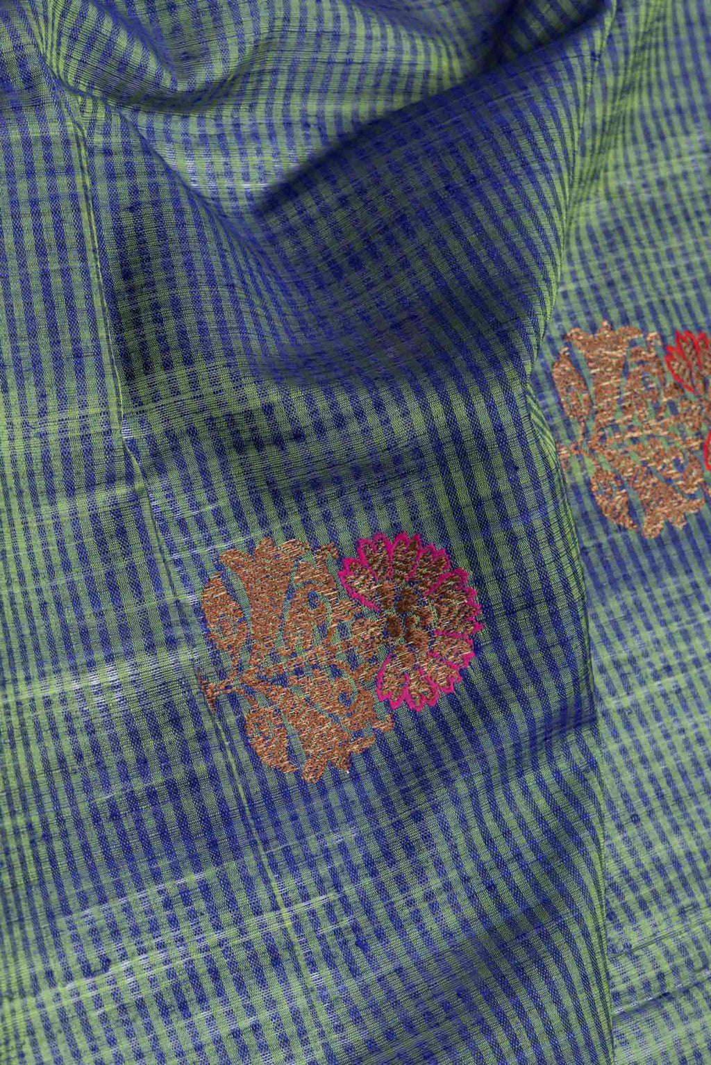 Close up of Green Dual Tone Banarasi Silk Saree with Stripes on the body and Zari Border.  displaying folds
