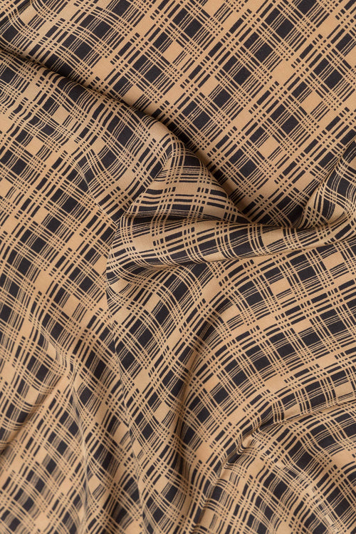 Close up of Black Dual Tone Mysore Crepe Saree with Printed design on the body and Printed Border.  displaying folds