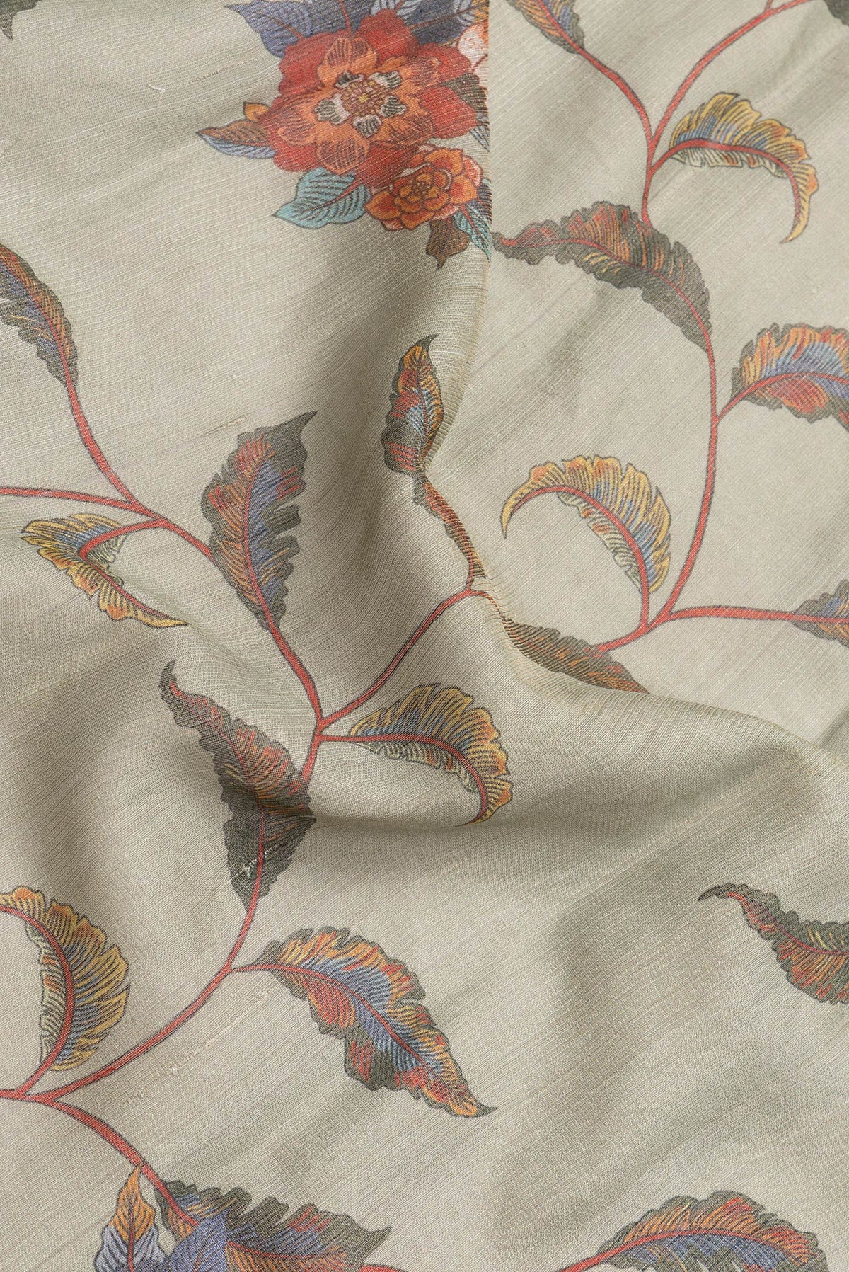 Close up of Pista Green Dual Tone Tussar Silk Saree with Printed design on the body and Thread Border.  displaying folds