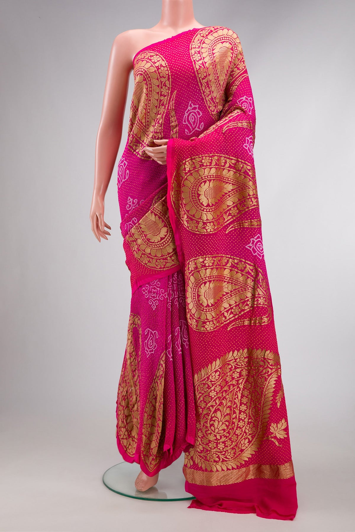 Pink Dual Tone Bandhani Silk Saree with Bandhani Print on the body and Fancy Border.  displayed on a mannequin