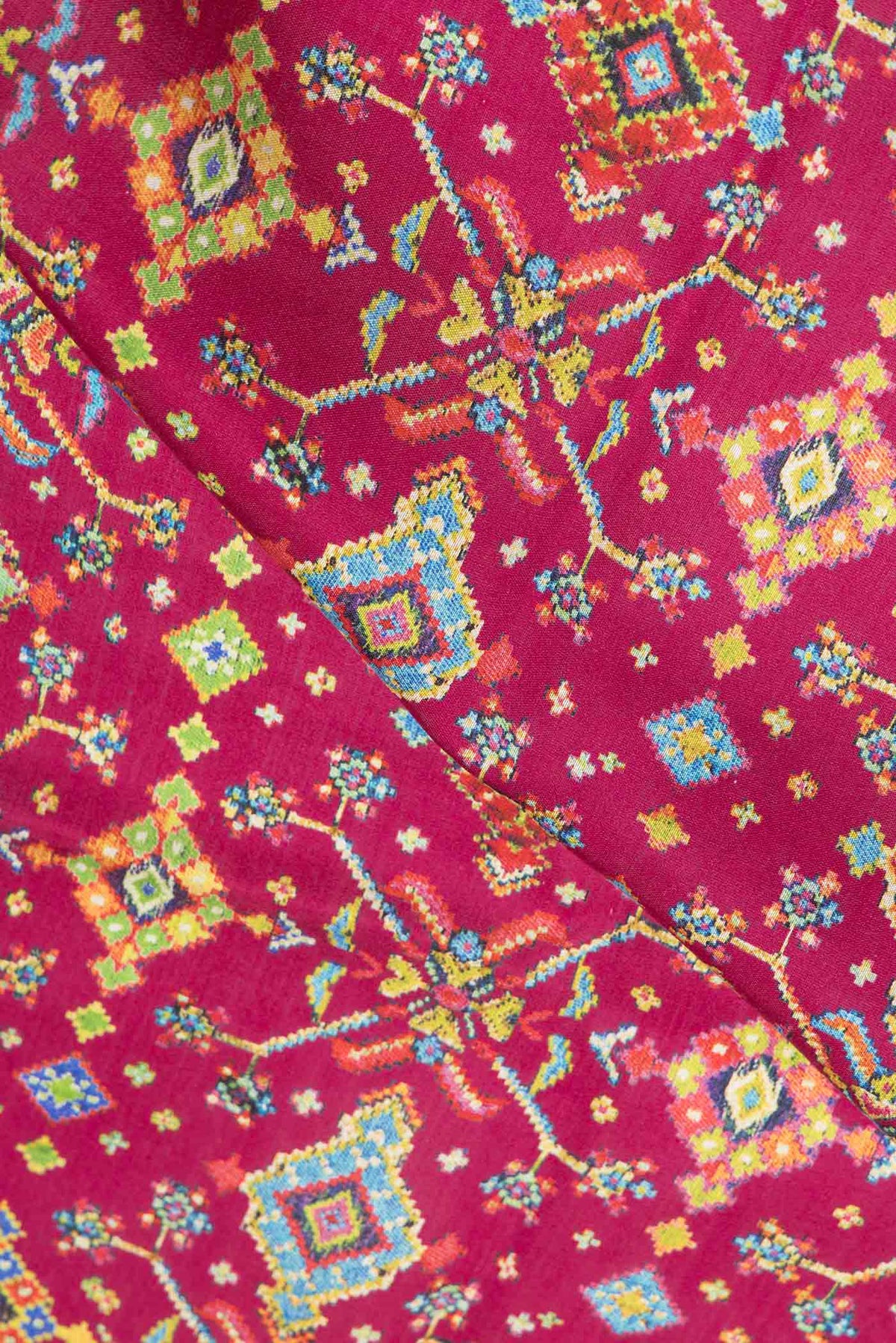 Close up of Pink Dual Tone Tussar Saree with Printed design on the body and Printed Border.  displaying folds