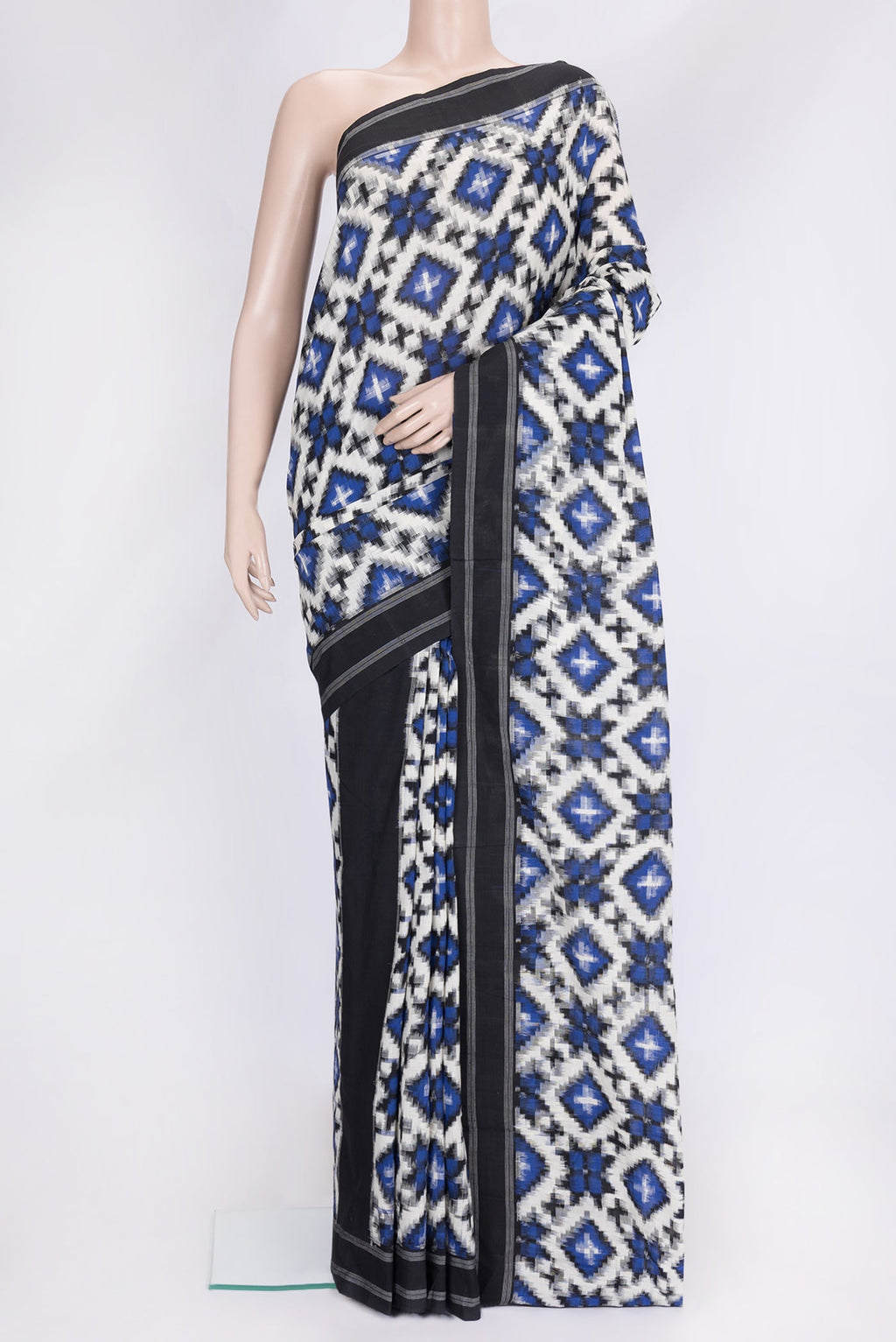 Off White Dual Tone Double Ikat Saree with Ikat Print on the body and Thread Border.  displayed on a mannequin