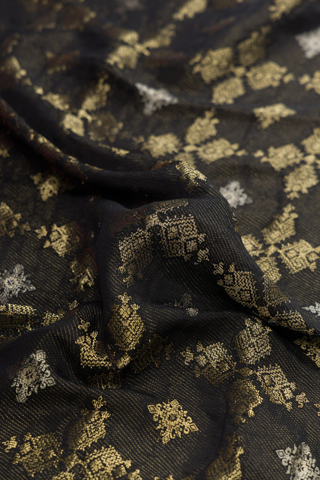 Close up of Black Dual Tone Mysore Georgette Saree with Zari Brocade on the body and Zari Border.  displaying folds