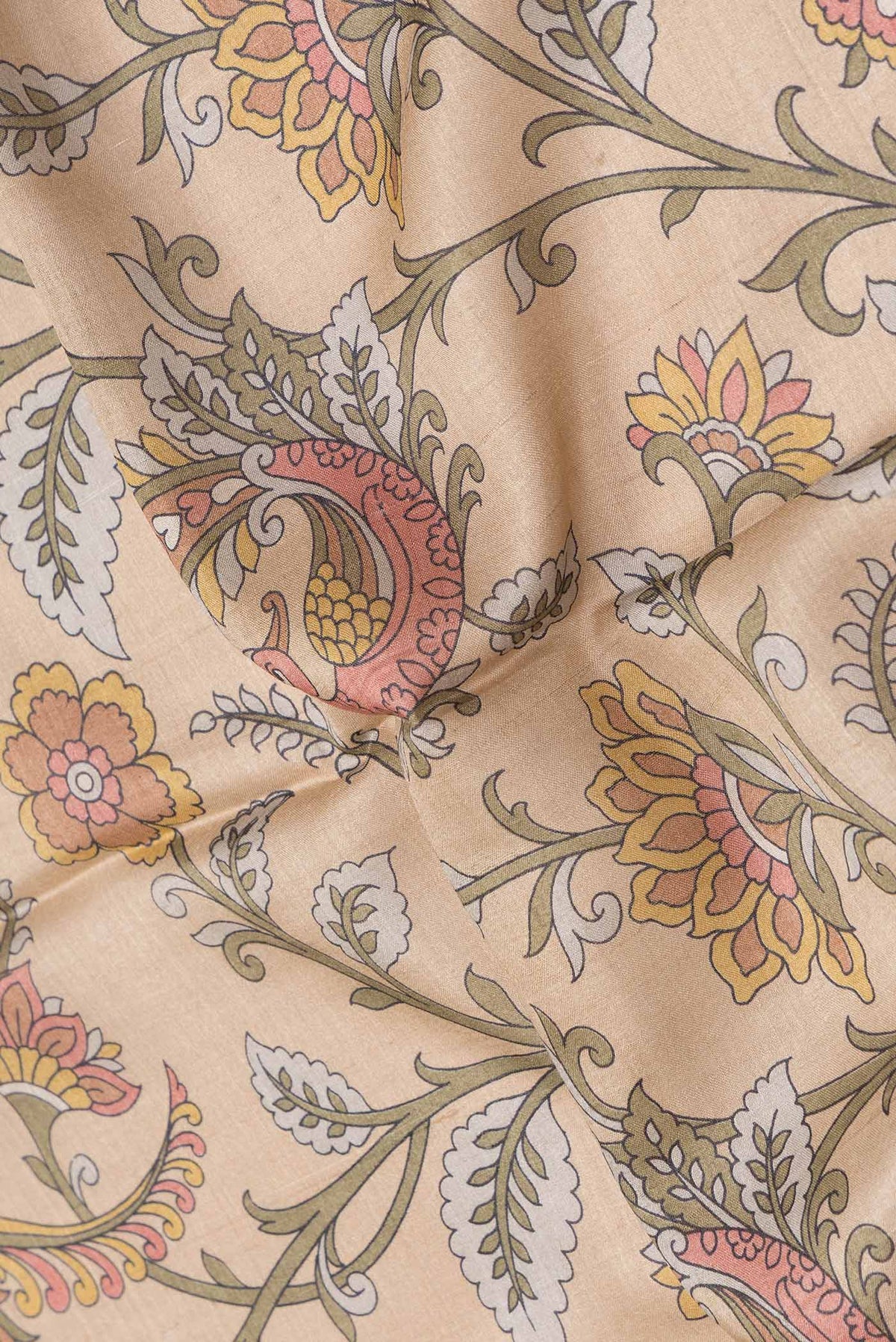 Close up of Beige Dual Tone Tussar Saree with Printed design on the body and Embroidery Border.  displaying folds