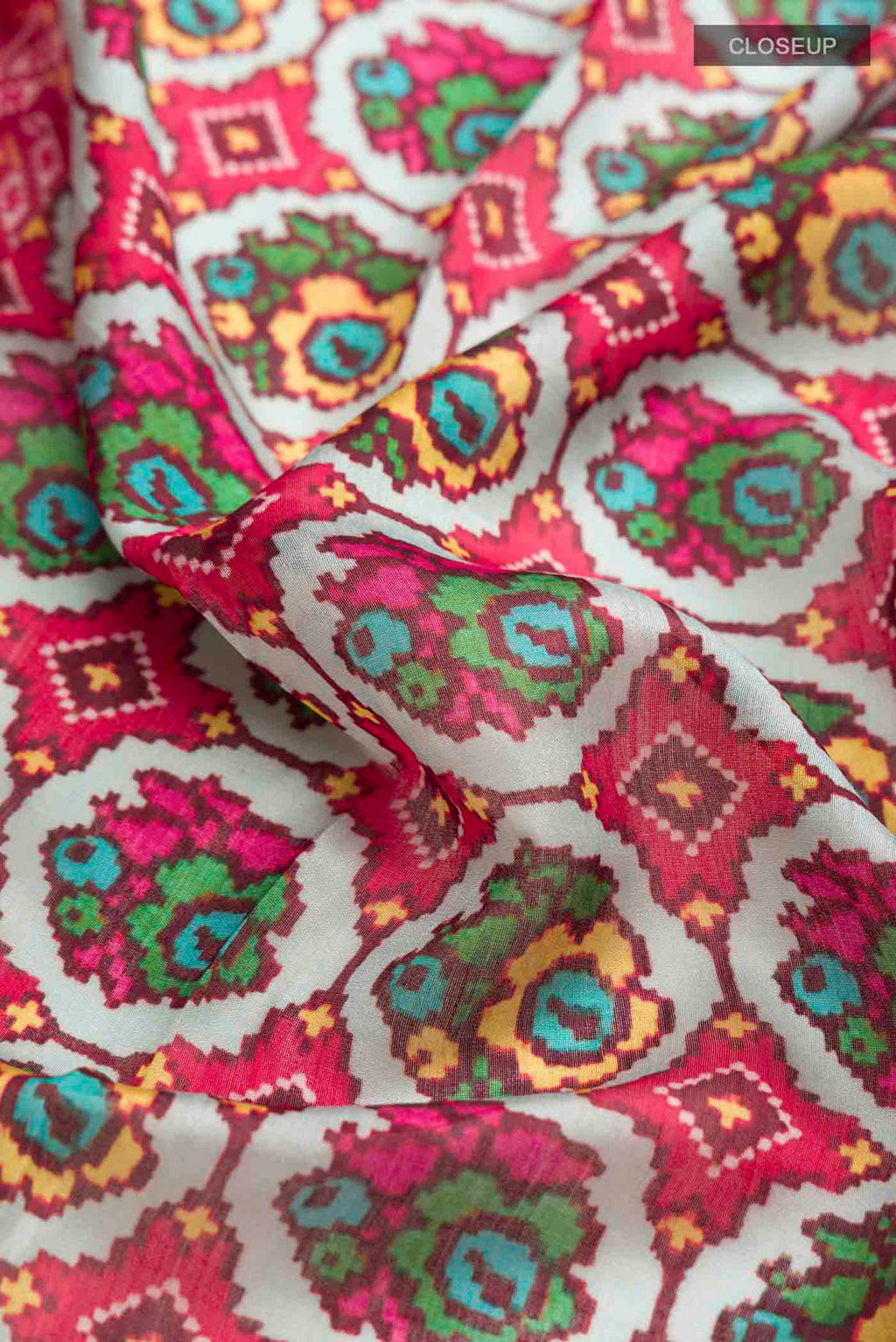 Close up of Grey Bhagalpuri Tussar Silk Saree with Printed design on the body and Zari Border displaying folds